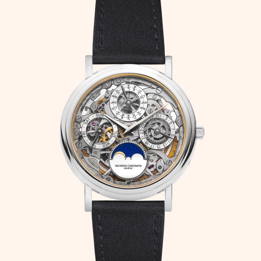 A round skeleton watch with visible gears and a moon phase.