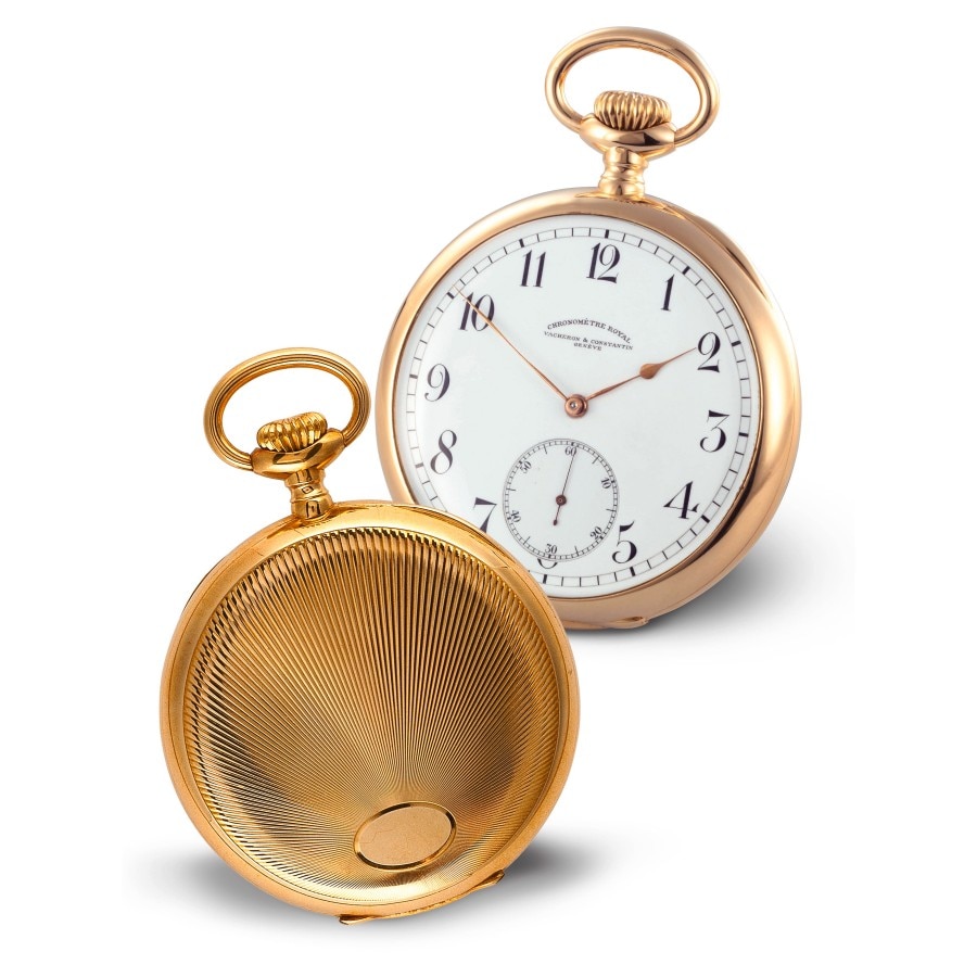 Two gold pocket watches, one closed and one open with a white dial.