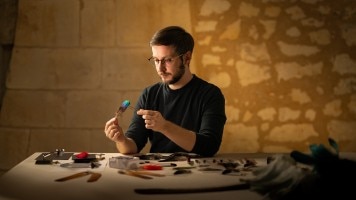  Artist working on the featherwork concept watch.