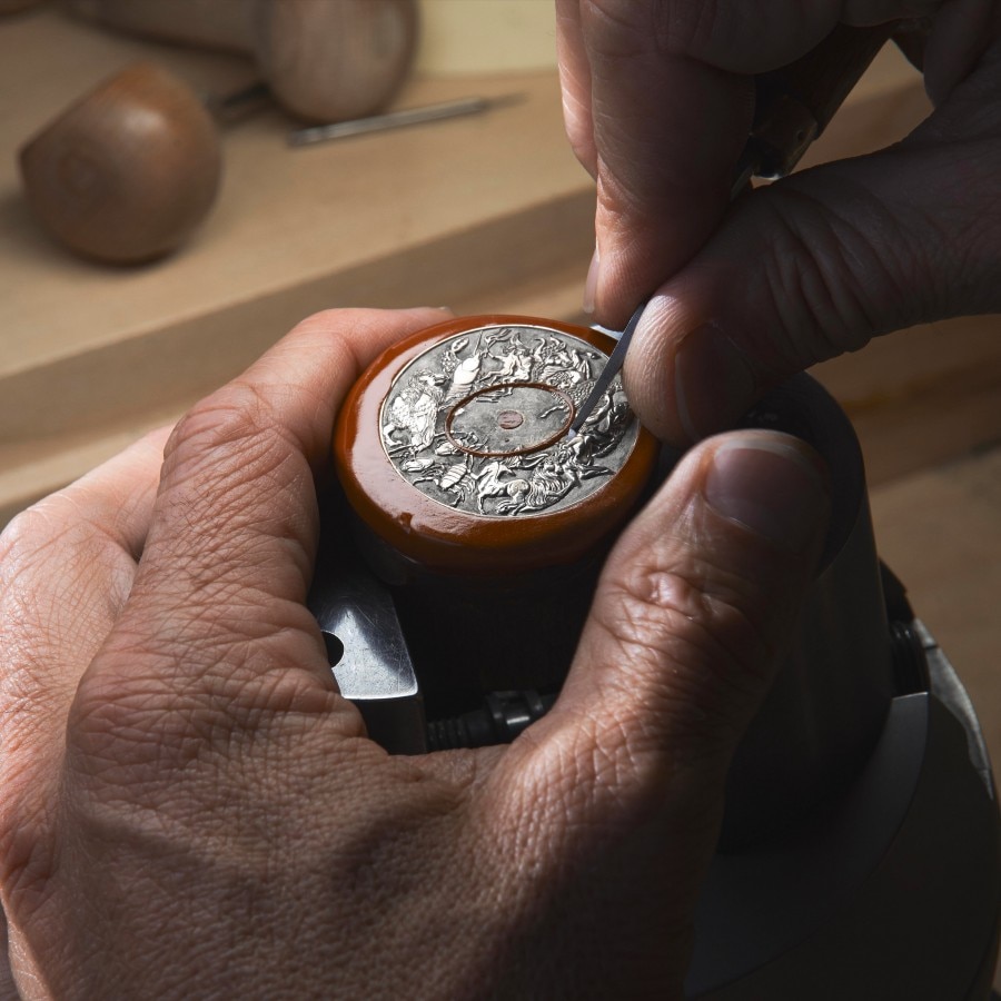 Watchmaker working on an opened watch