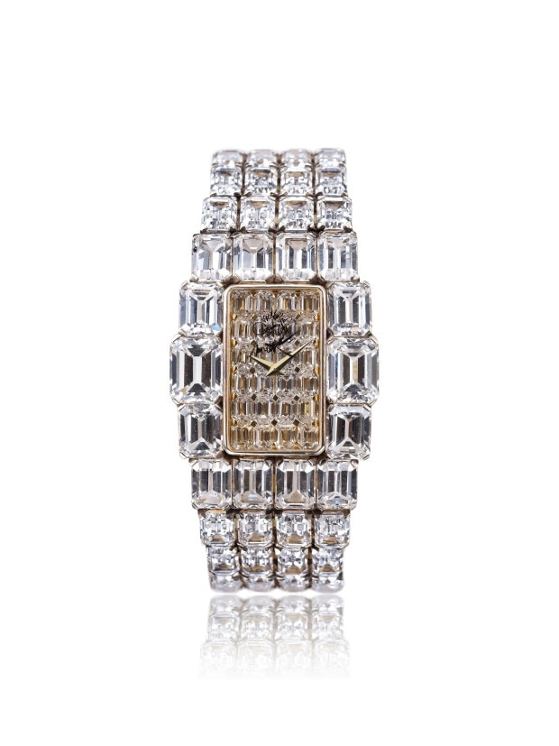 Luxury diamond-encrusted wirstwatch with a rectangular face.