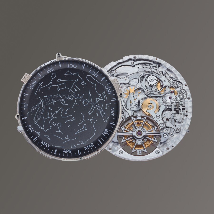Mechanical watch with an astronomical dial on the left and exposed gears on the right.