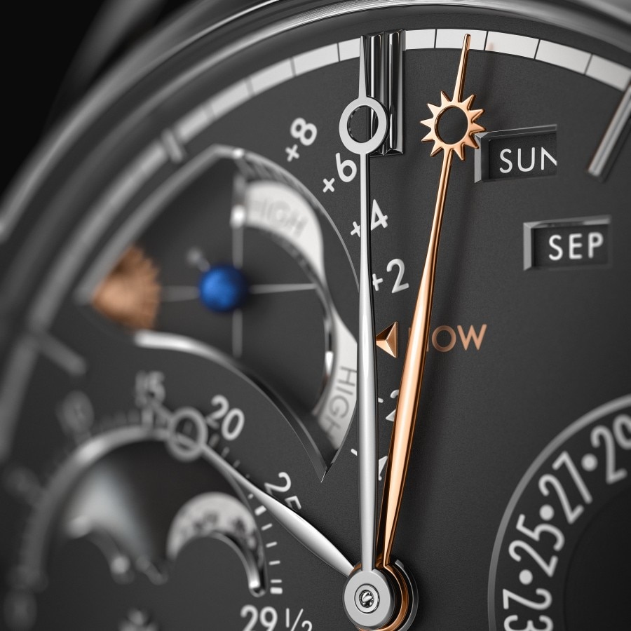 Black watch background with gold and silver details, close-up view