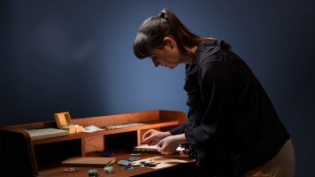  Artist creating a micro origami concept watch.