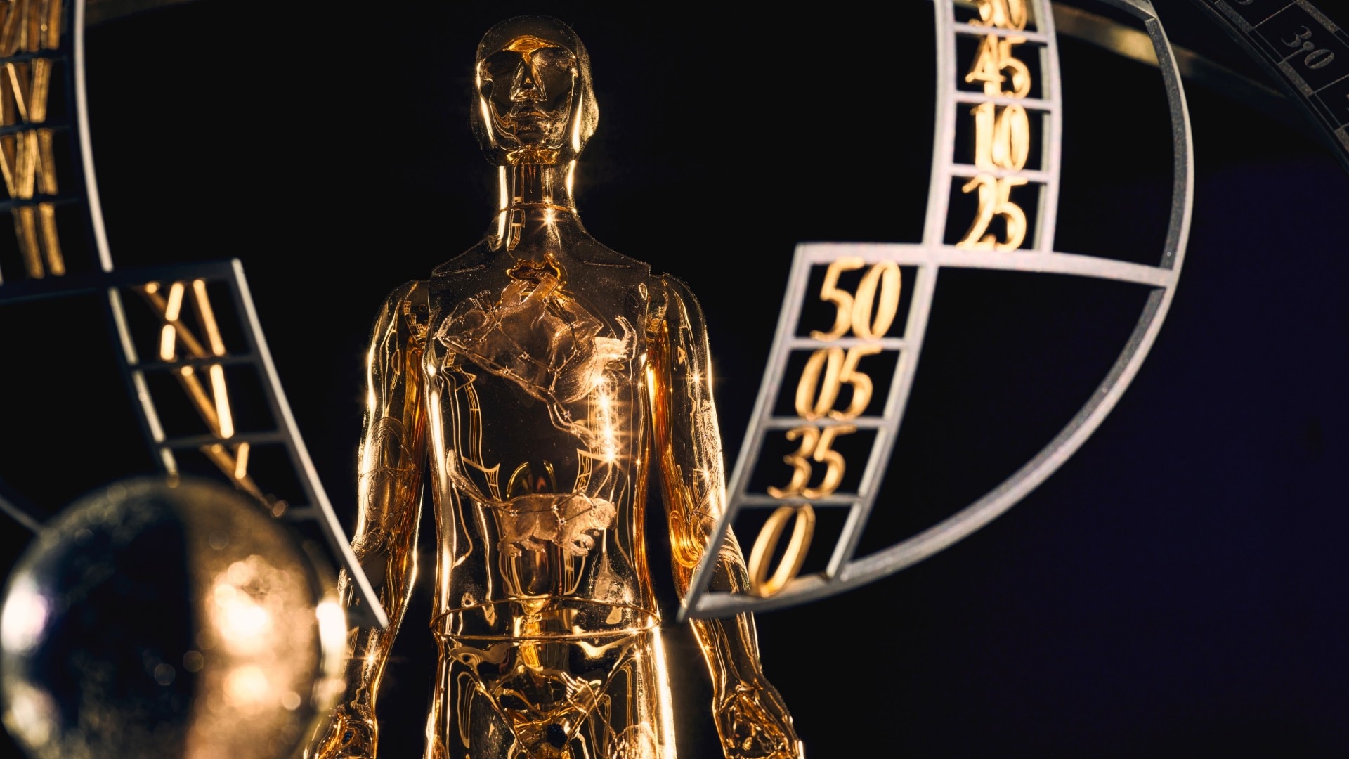 Image illustrating the gold automaton in the center of the dial