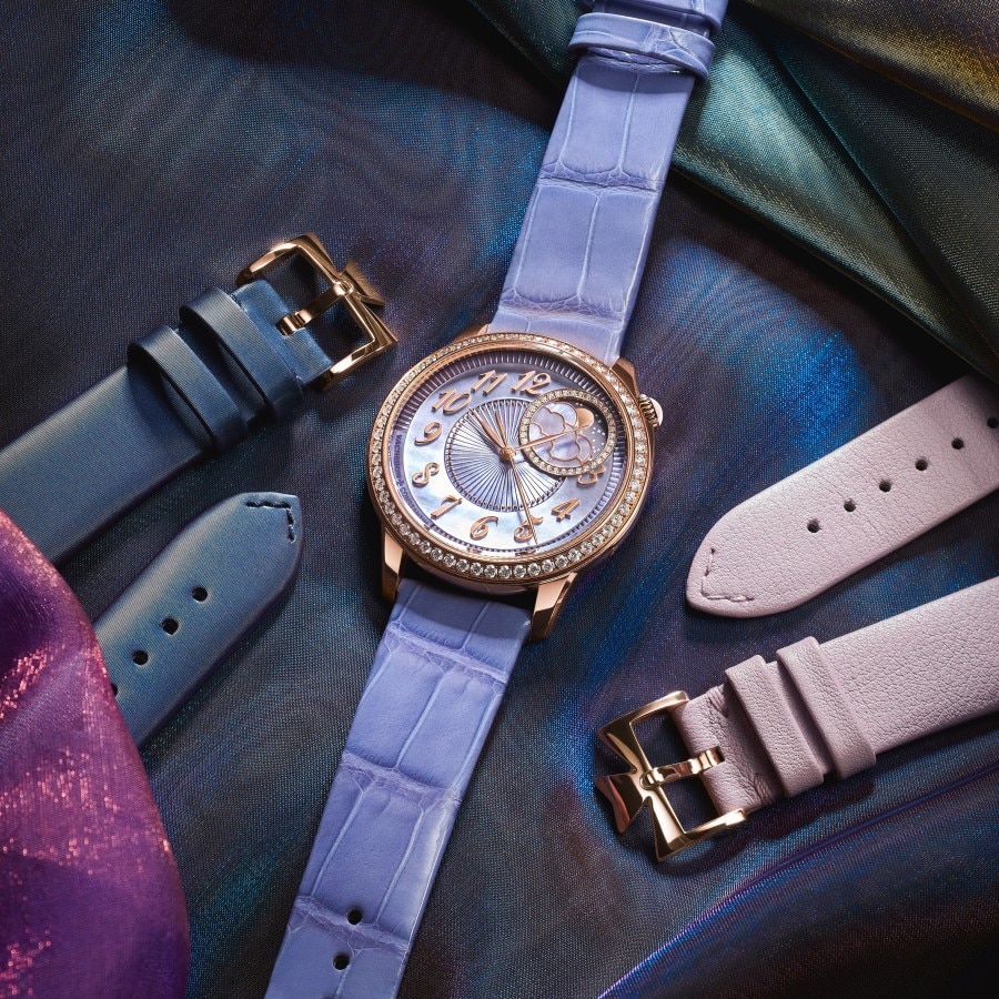 Égérie Moon phase in pink gold with a purple dial and strap and a bezel set with diamonds