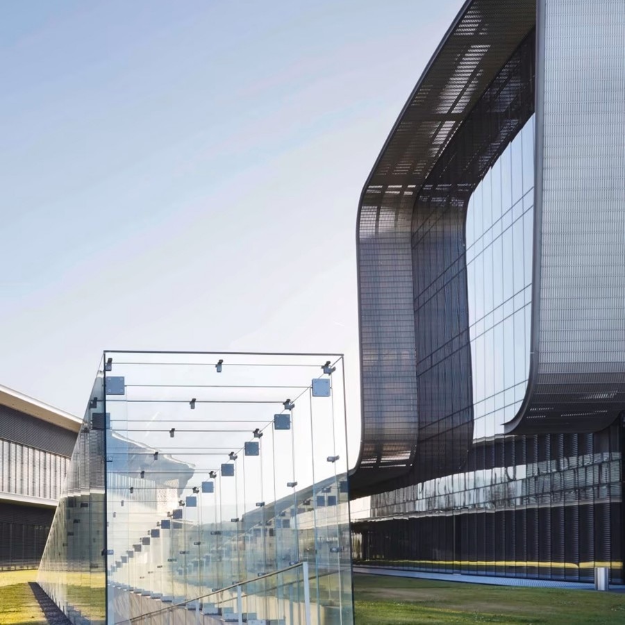 Modern glass and steel building of the Vacheron Constantin manufacture.