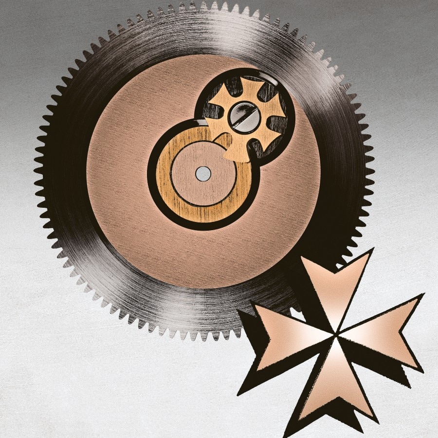 A large gear and a gold Maltese cross logo on display.