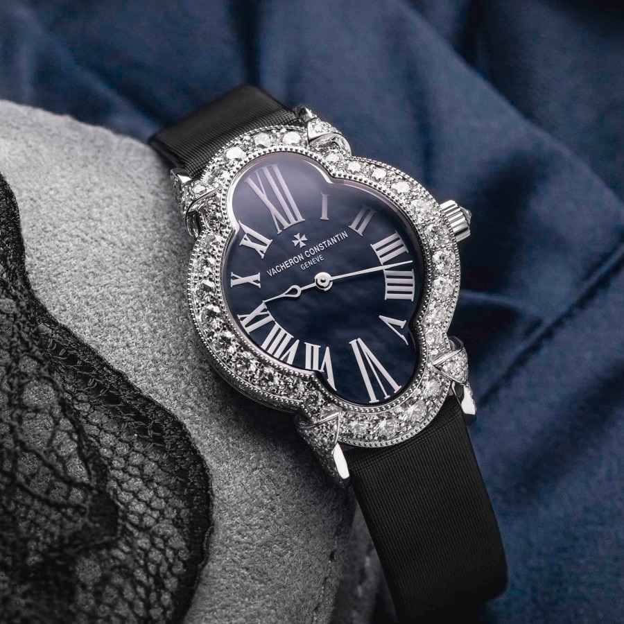 Heures Créatives watch with a blue dial with diamonds around and a black strap