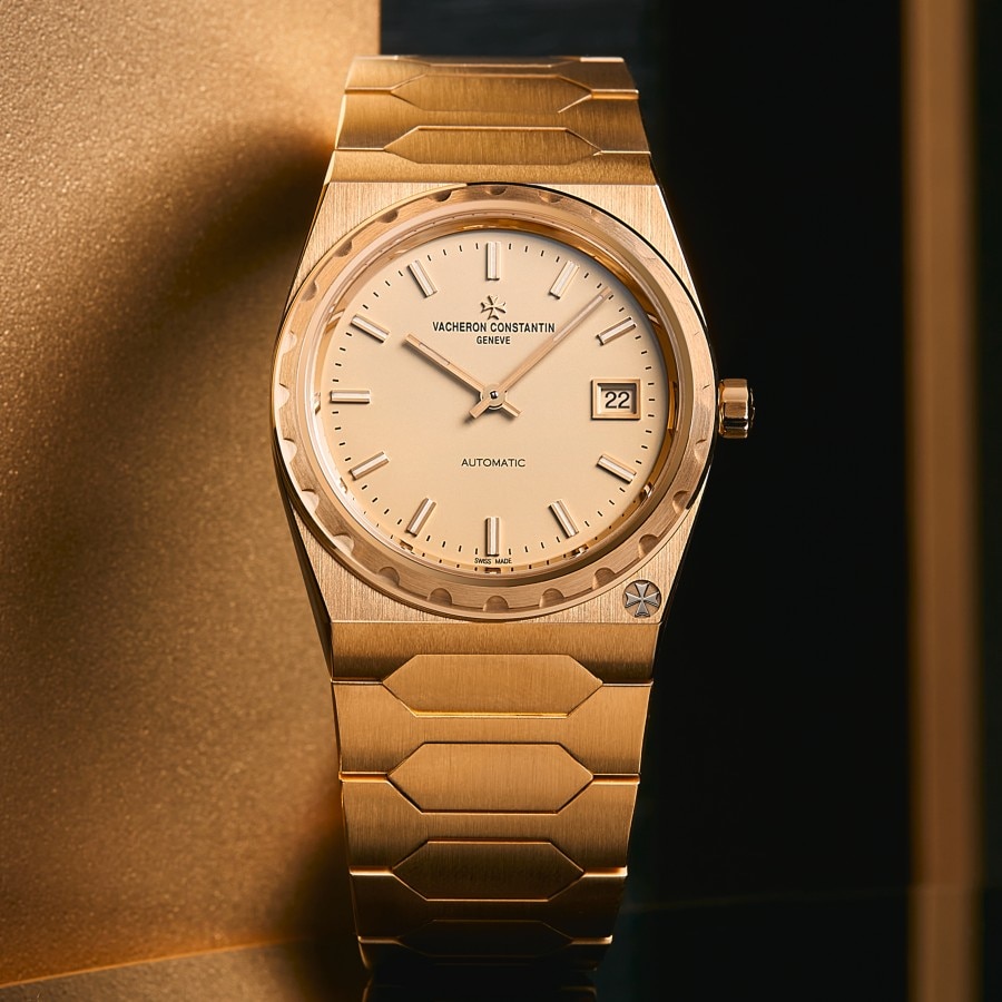 Front view of an Historiques 222 in yellow gold, reflecting in a mirror.