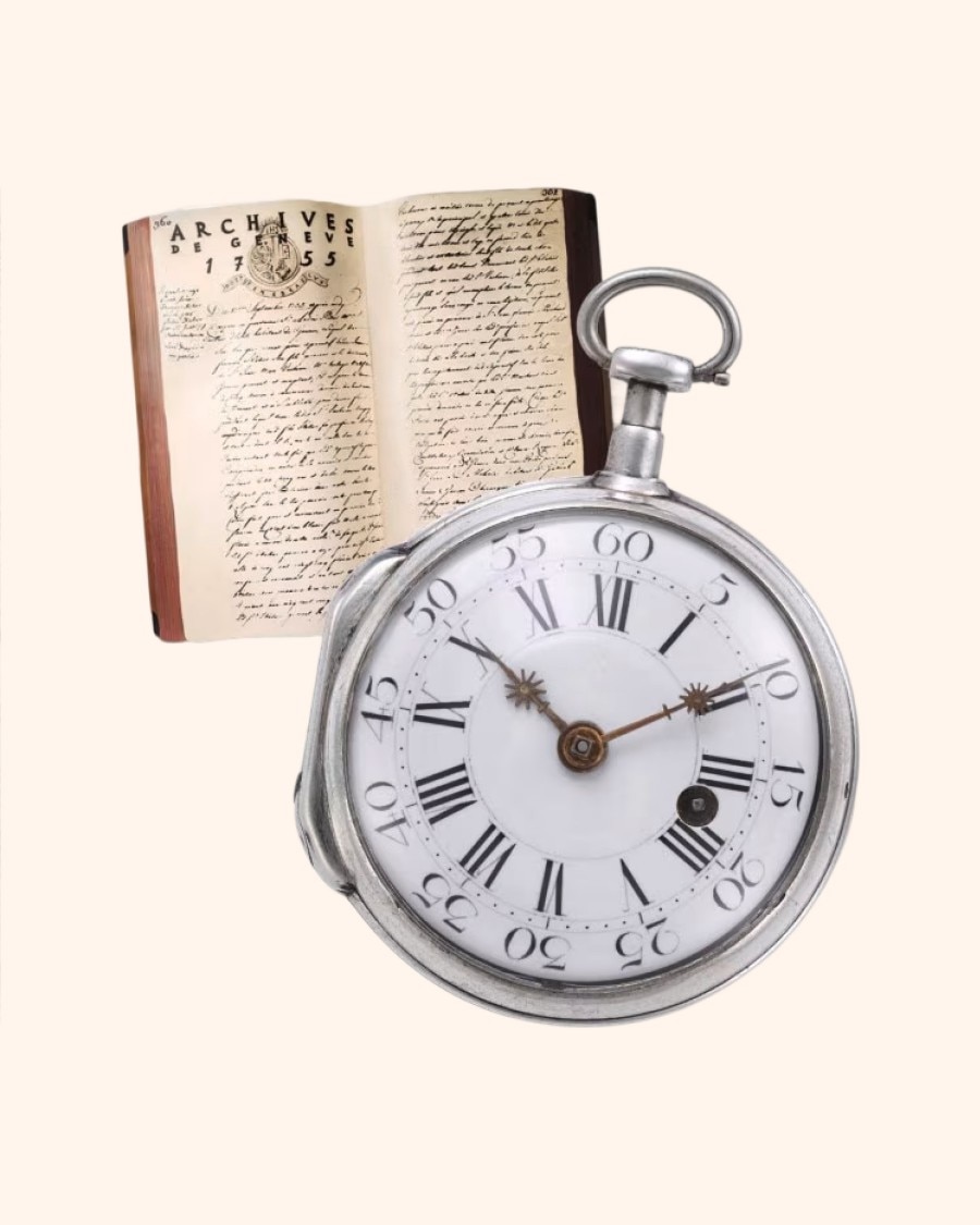 An antique pocket watch with Roman numerals, placed in front of an open book with handwritten text.