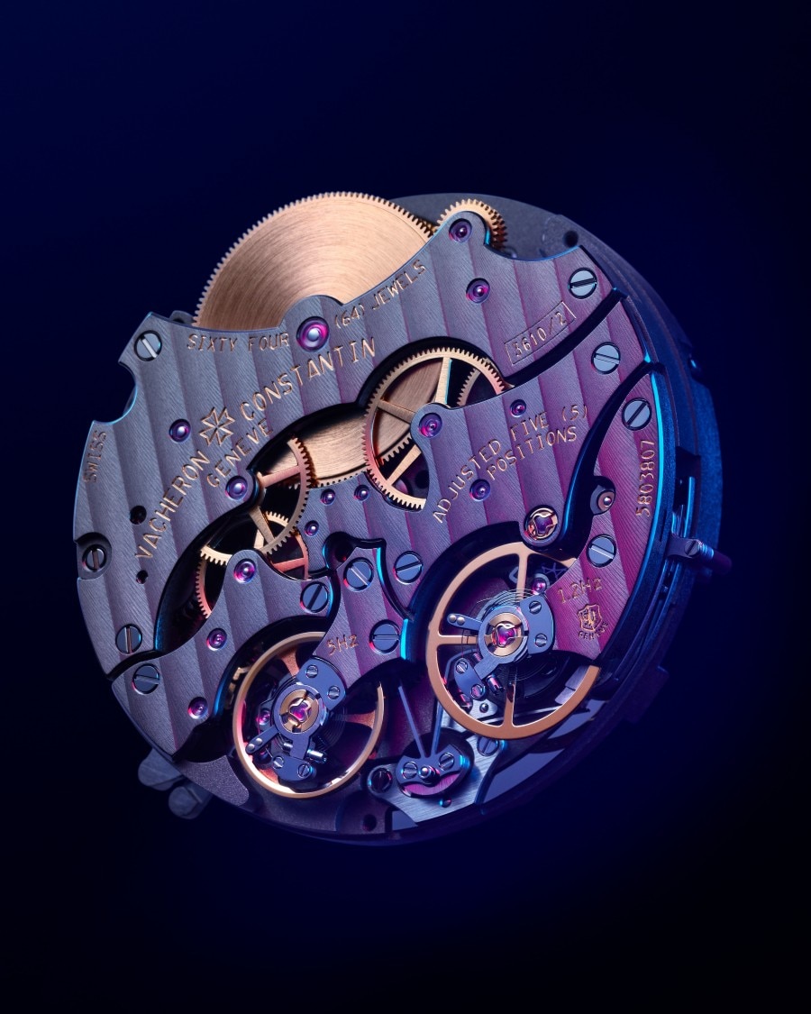 Close-up side view of the Traditionnelle Twin Beat perpetual calendar caliber on a dark background.