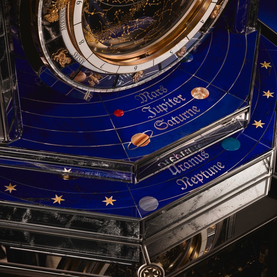Image illustrating the solar system on the base of the clock
