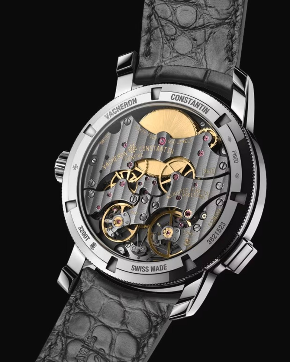 Close-up of a luxury watch showcasing its intricate exposed movement, with visible gears and sparkling jewels.