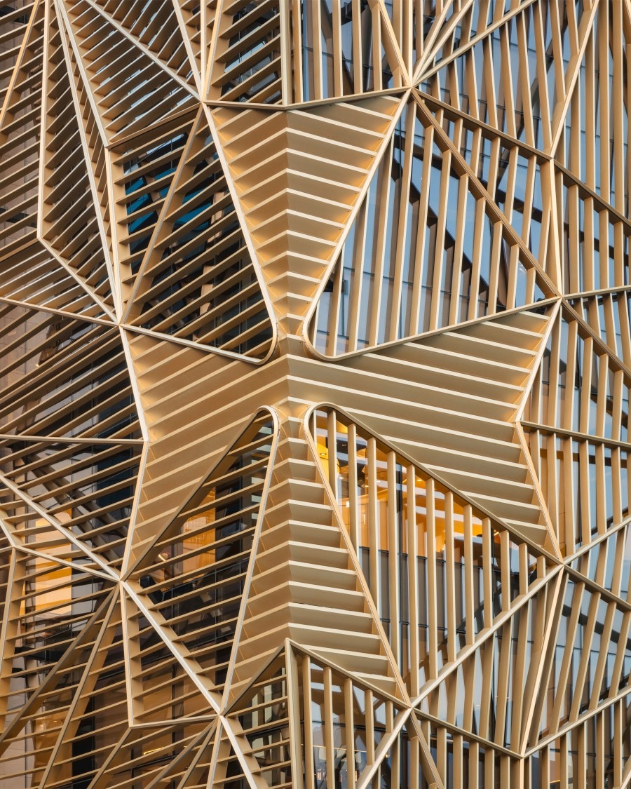 The gold-tone metallic Maltese cross, an emblem of Vacheron Constantin.