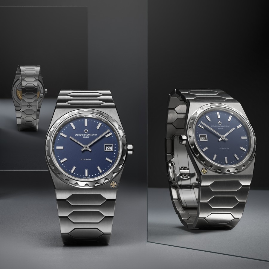 Front view of an Historiques 222 in steel with a blue dial, reflecting in a mirror.