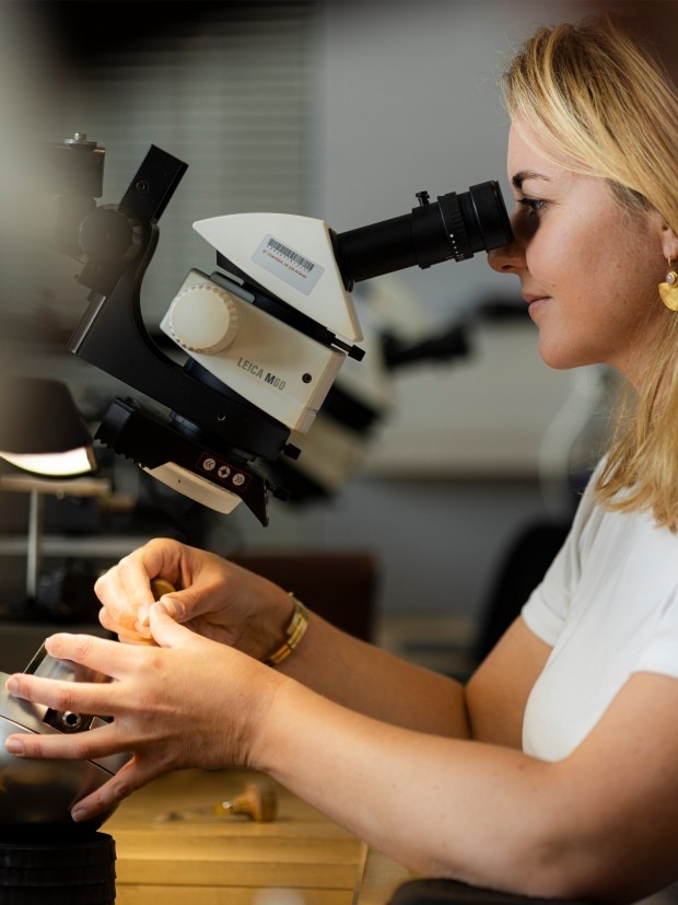 Watchmaker working in a modern office environment