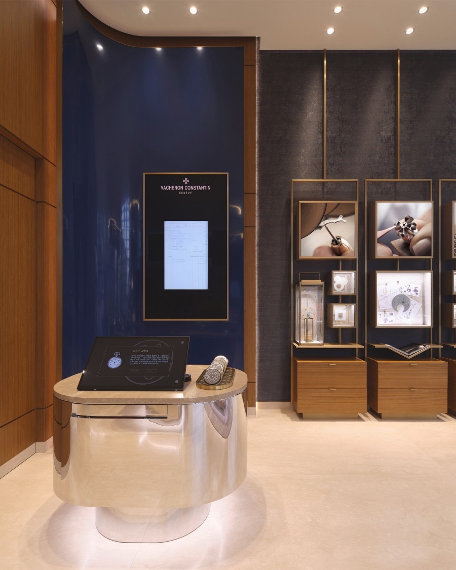 An exhibition showing images and sketches of the watchmaking process, highlighting Vacheron Constantin's craftsmanship.