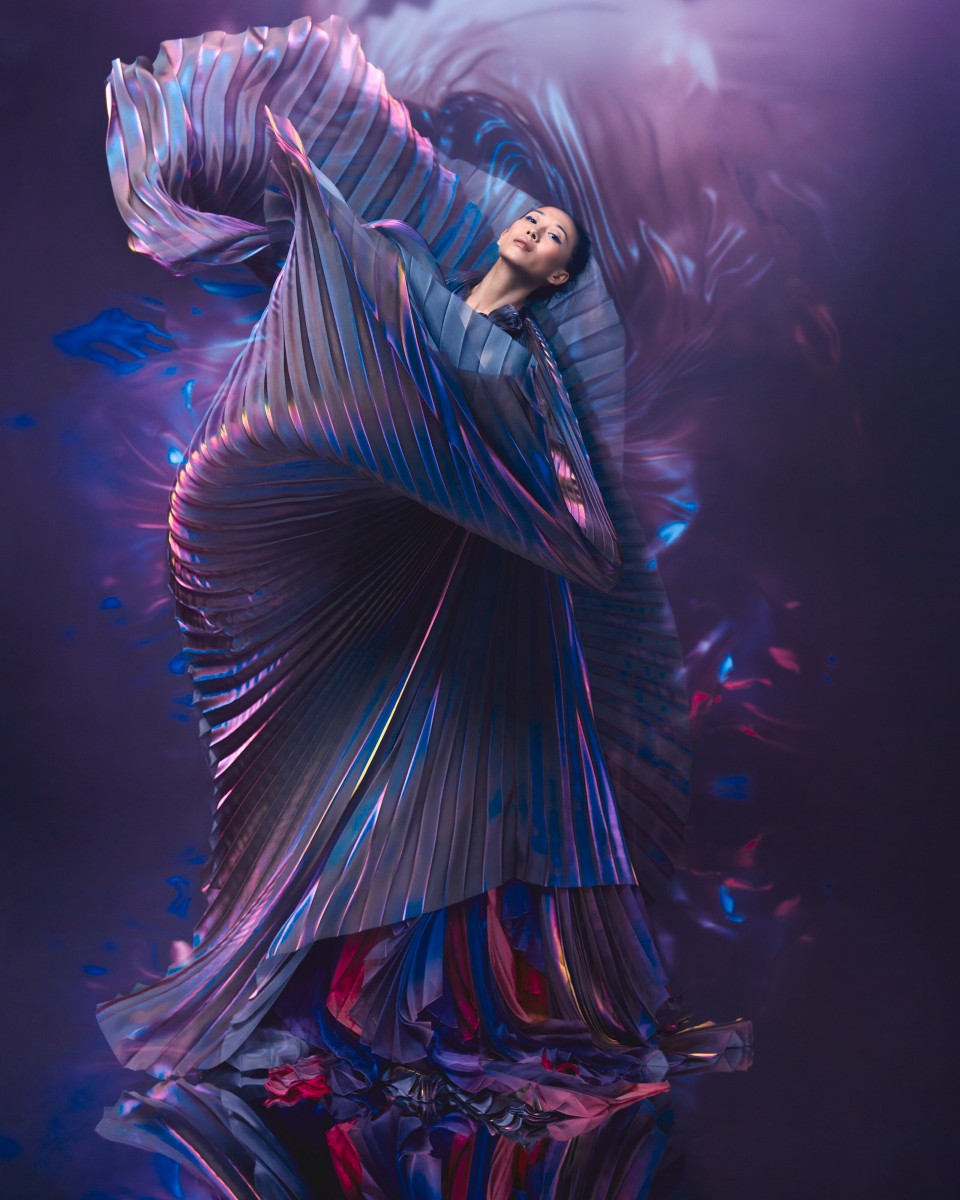 Yiqing Yin works in a beautiful purple dress