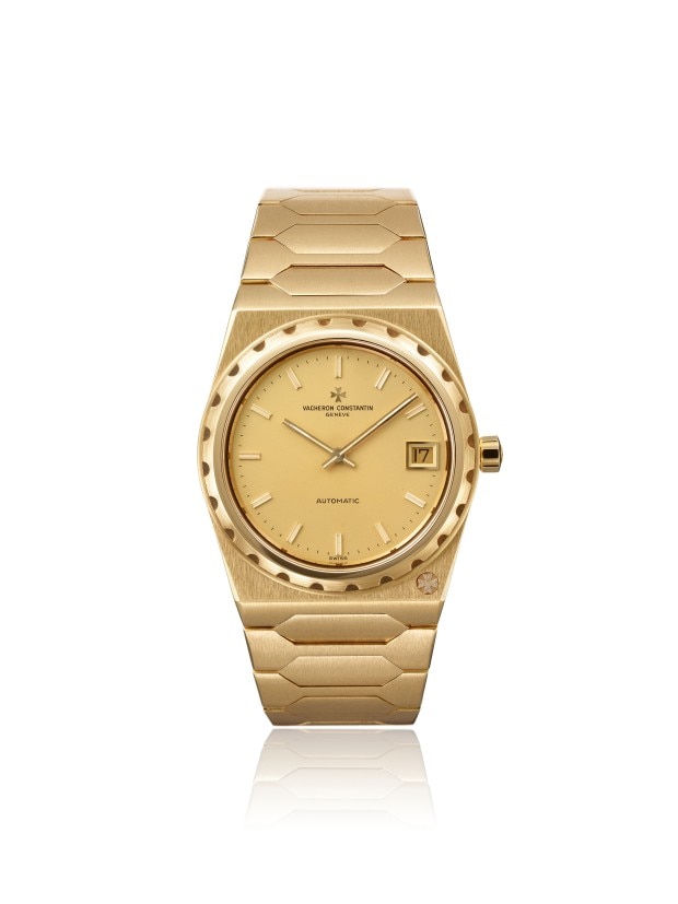 Gold-toned automatic wirstwatch with a date display and integrated bracelet design.