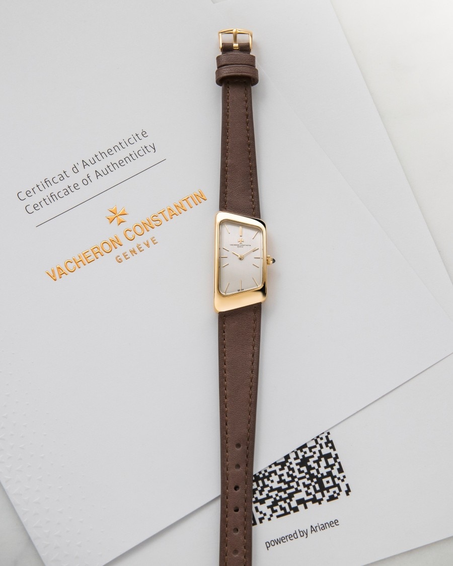 Vintage watch on a Certificate of Authenticity document