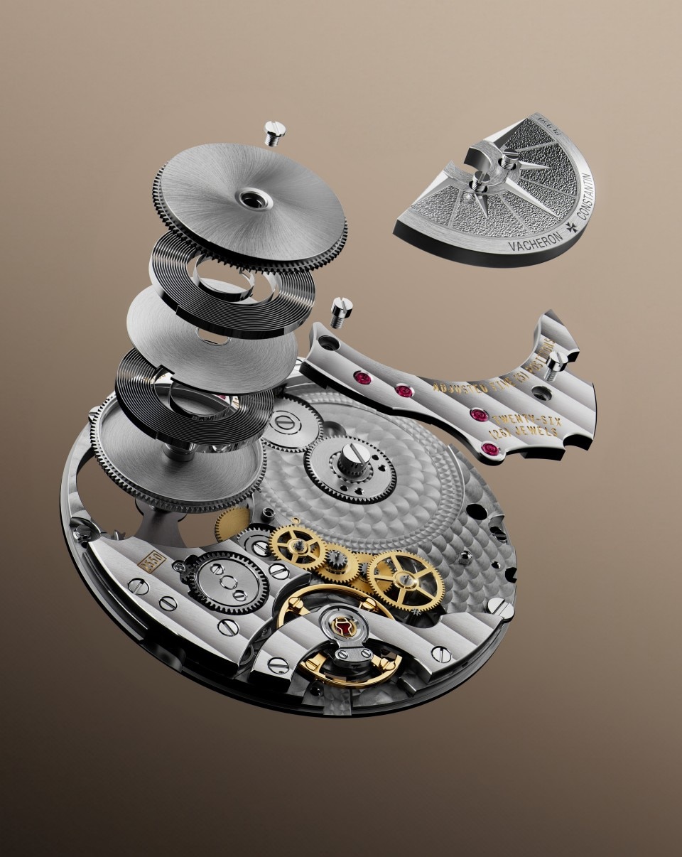 Exploded view of a mechanical watch movement showing gears, plates, and internal components separated.
