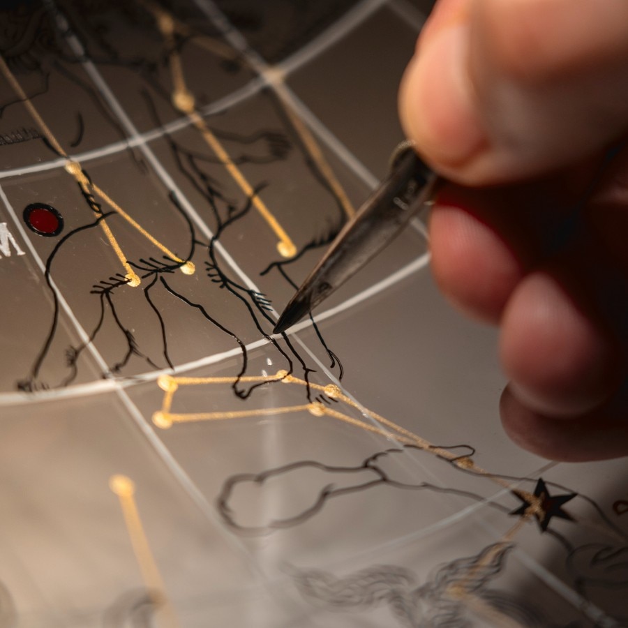 Image illsutrating a brush painting a constellation