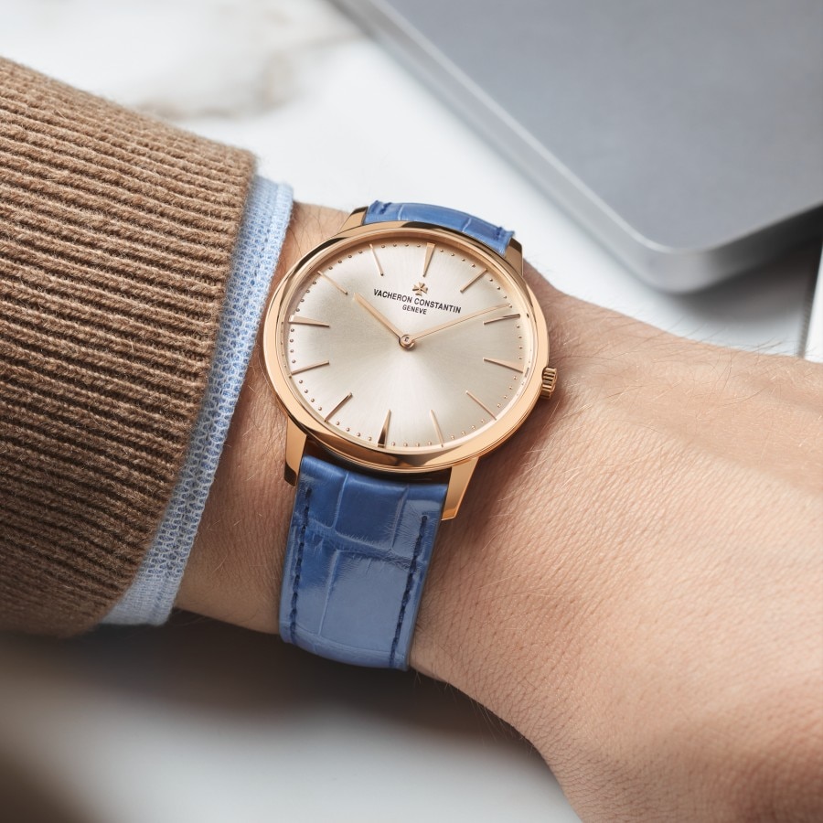 Patrimony with a fresh azure blue color strap on a wrist