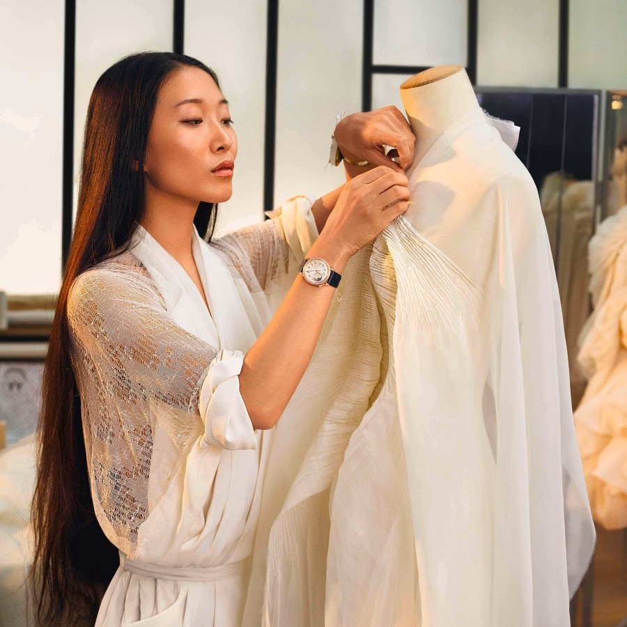 Yiqing Yin wearing an Egérie, working on a dress