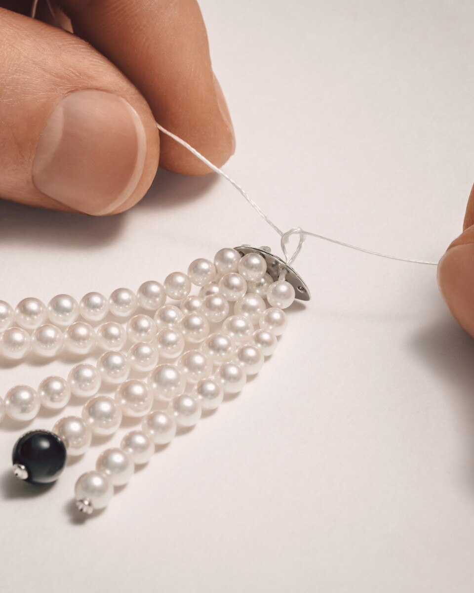 Hands creating an elegant jewelry pices