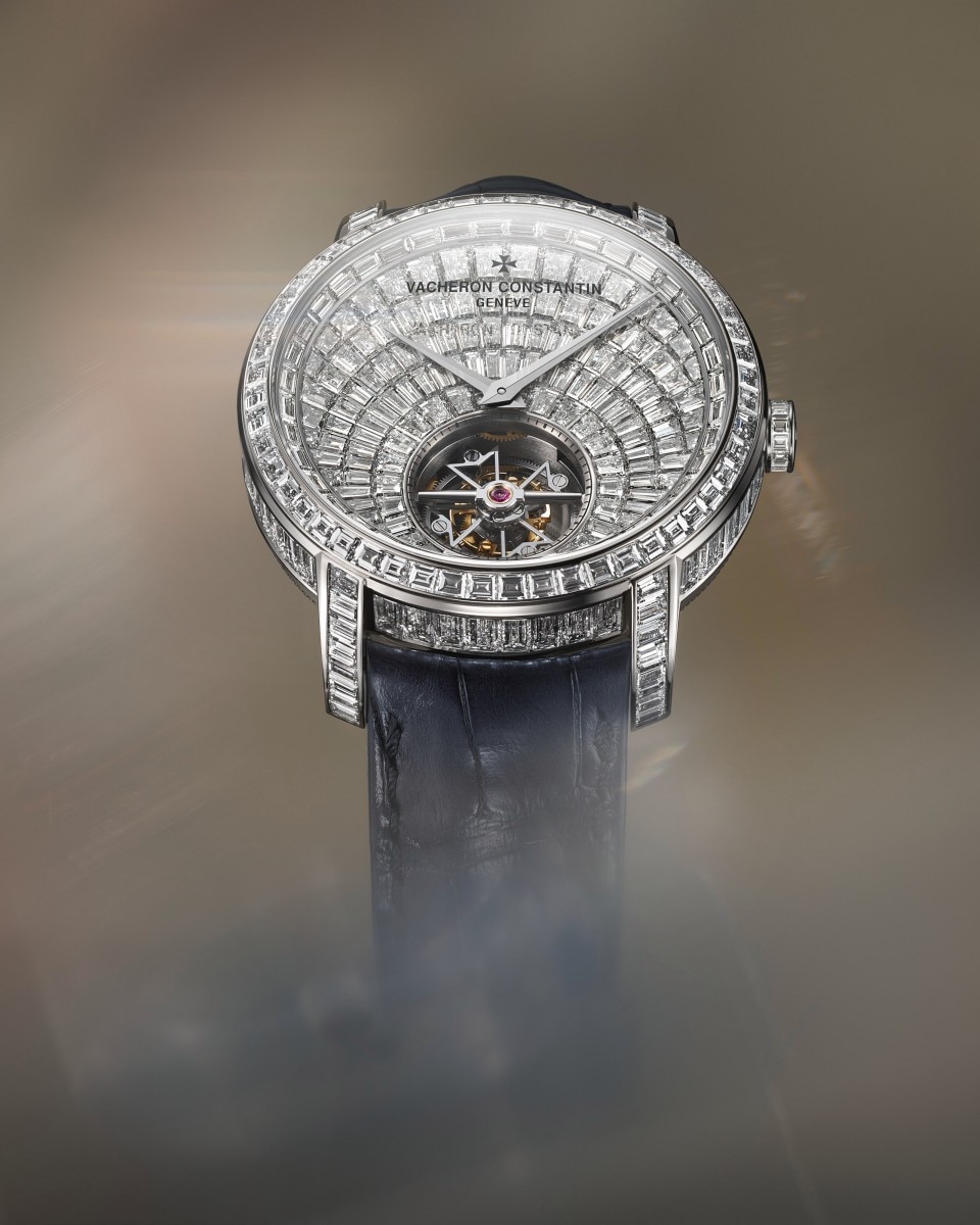 High jewerly watch fully set with baguette-cut diamonds and visible tourbillon.